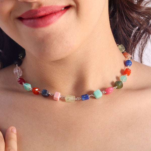 Woman wearing multicolor gemstone necklace, stylish jewelry accessory