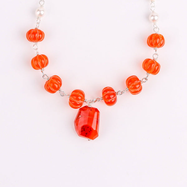 Macro detail of lustrous pearls and semiprecious stones with polished 92.5 sterling silver finish