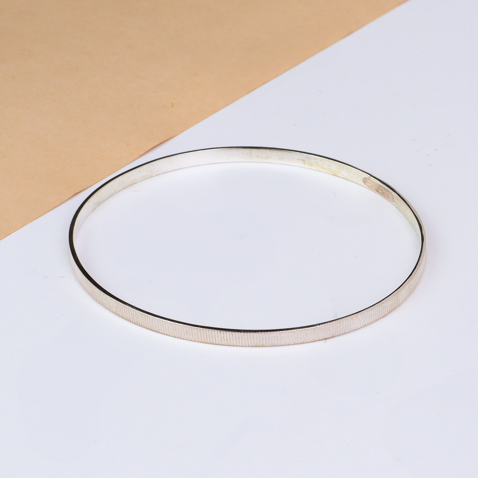 Silver linear textured bangle