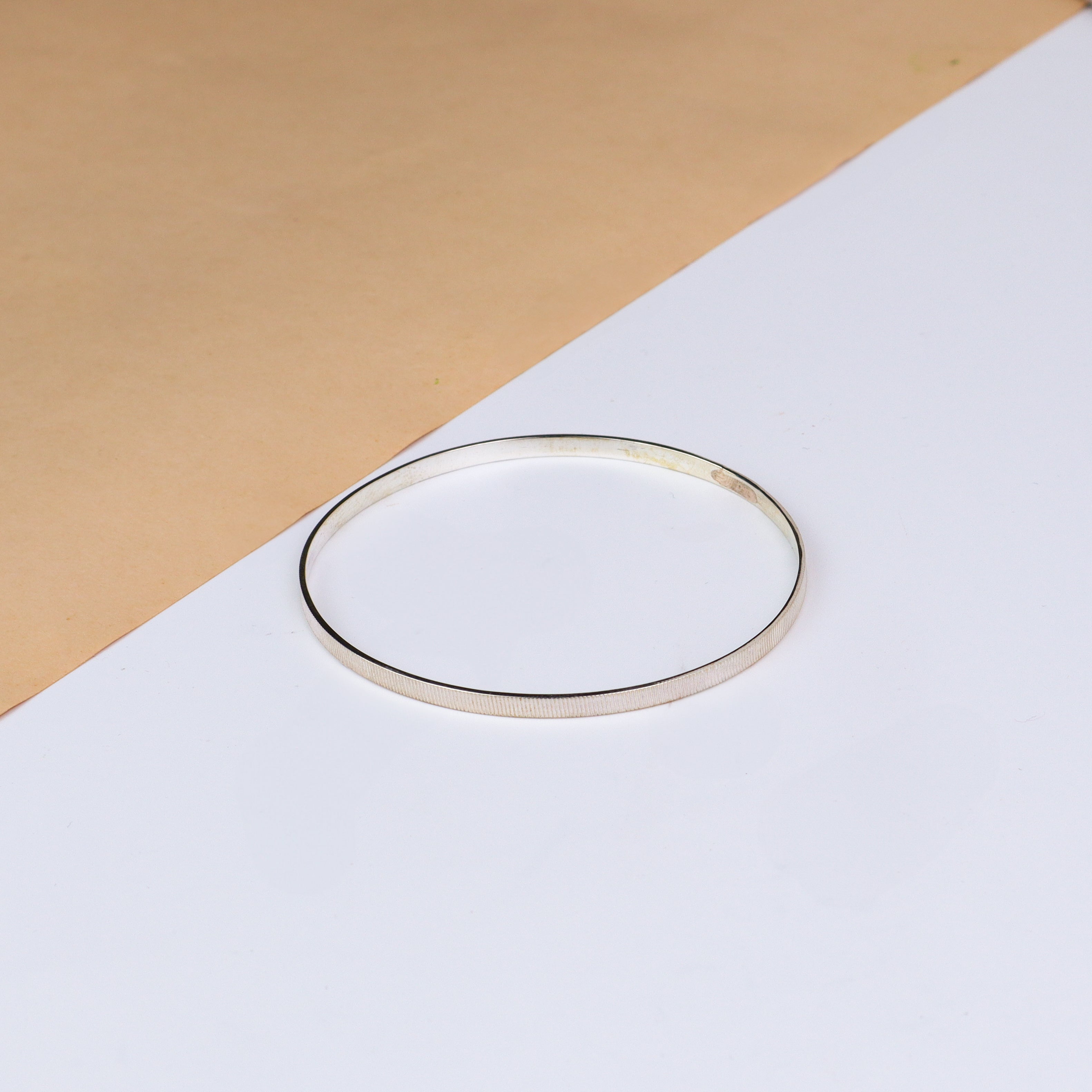 Silver linear textured bangle