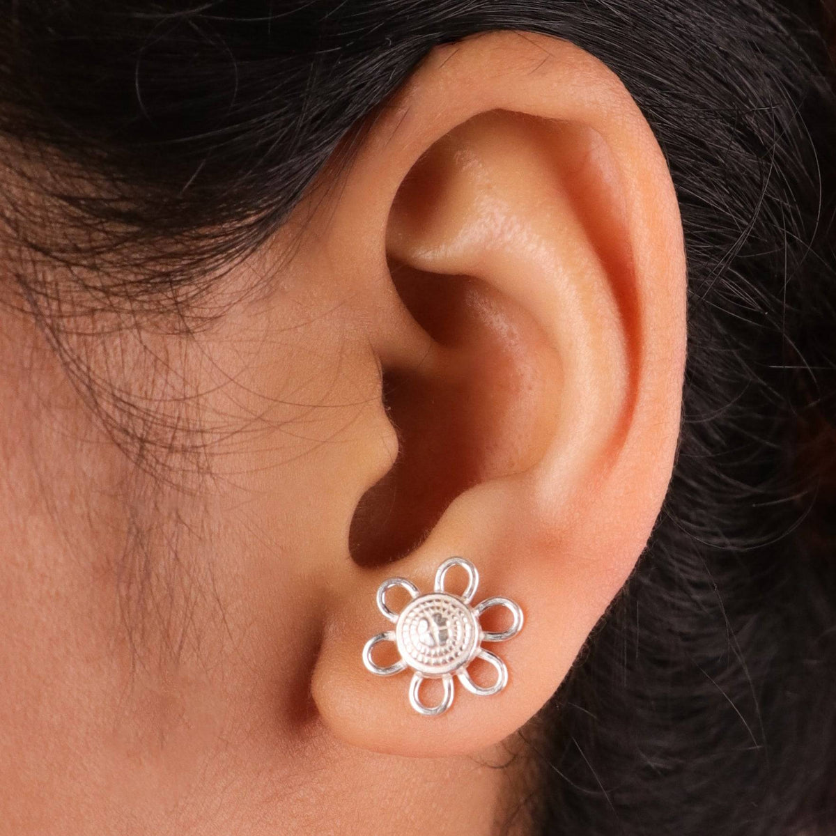 Silver floral charm jewelry set on white background