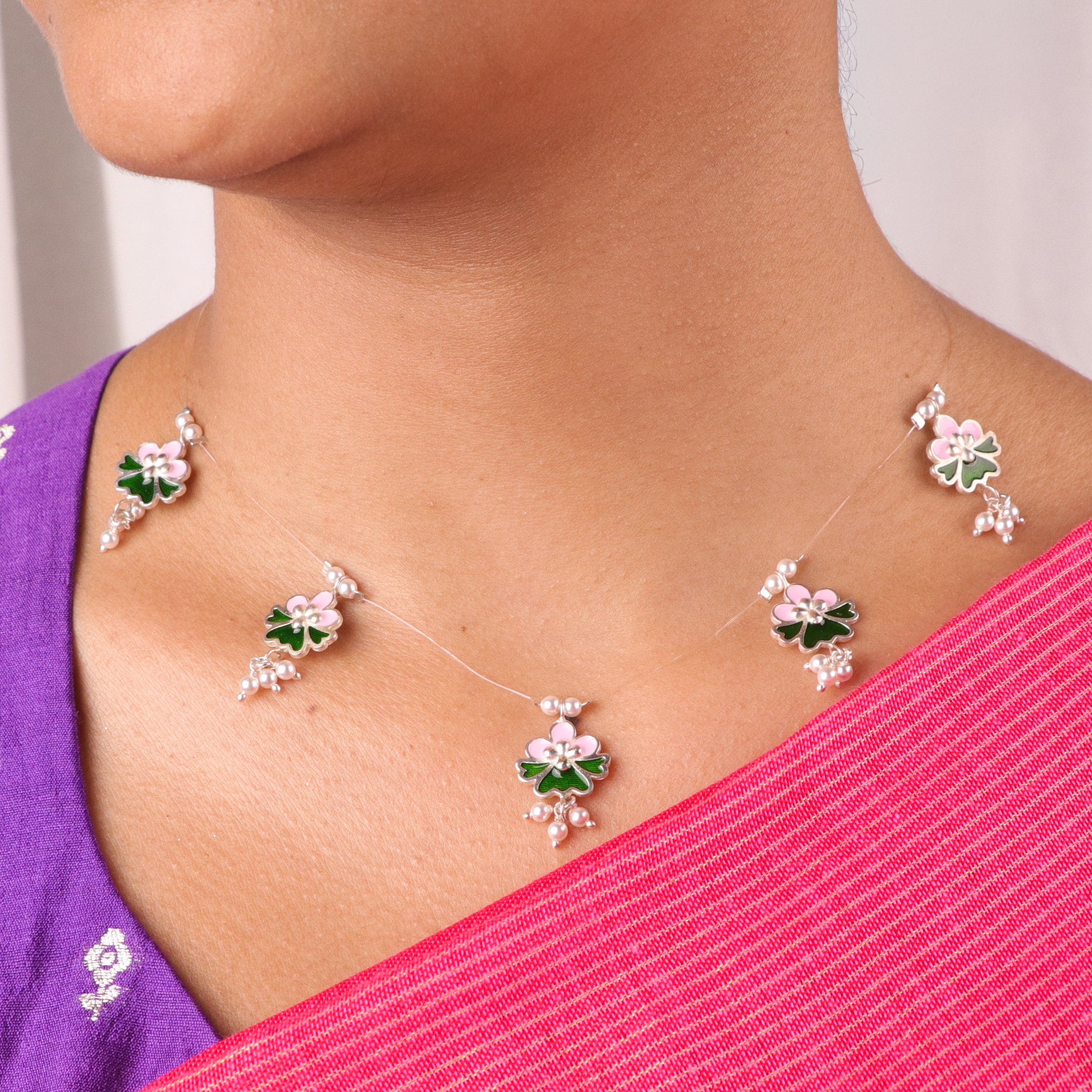 Meena charm set with invisible thread