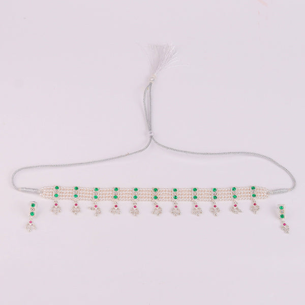 Flat lay of Silver Green Stone and Pearls Chinchapeti Set