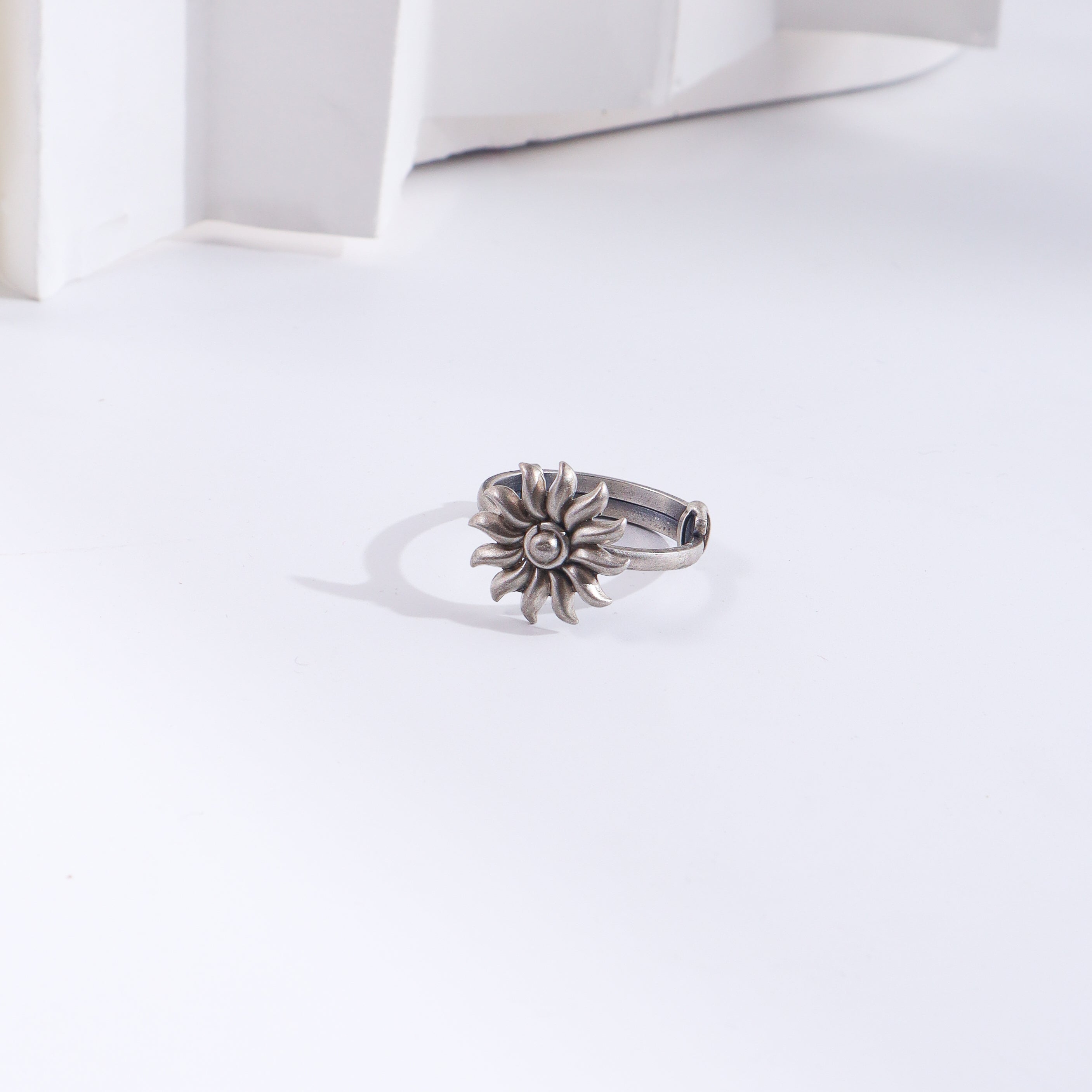 Silver Sun ring with floral design
