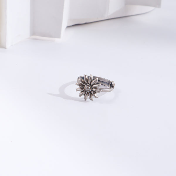 Silver Sun ring with floral design