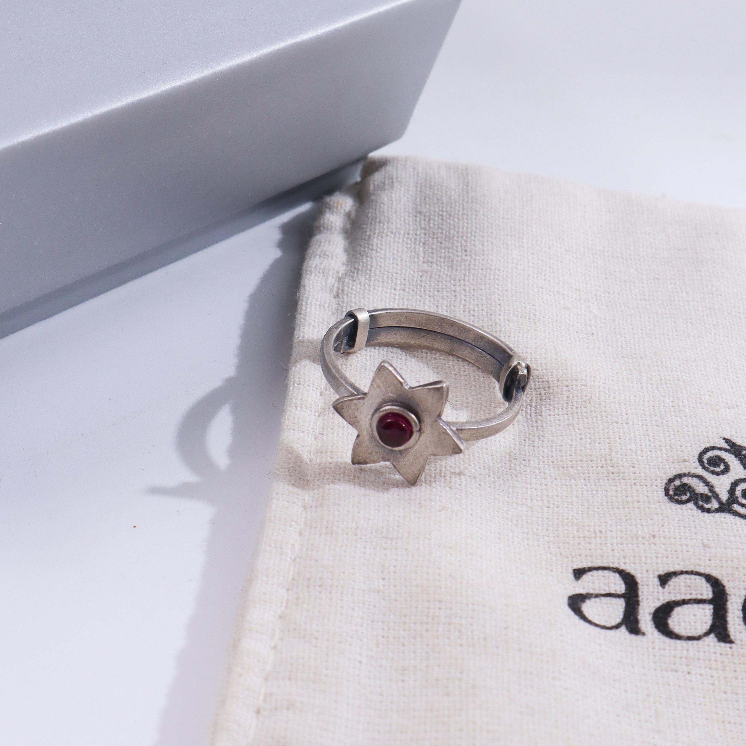 Silver Star Ring on white fabric