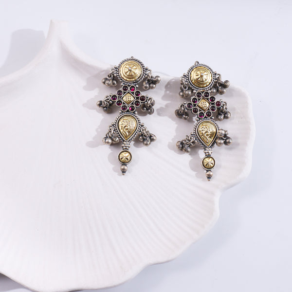 Silver Rajasthani earrings with intricate design and dangling elements