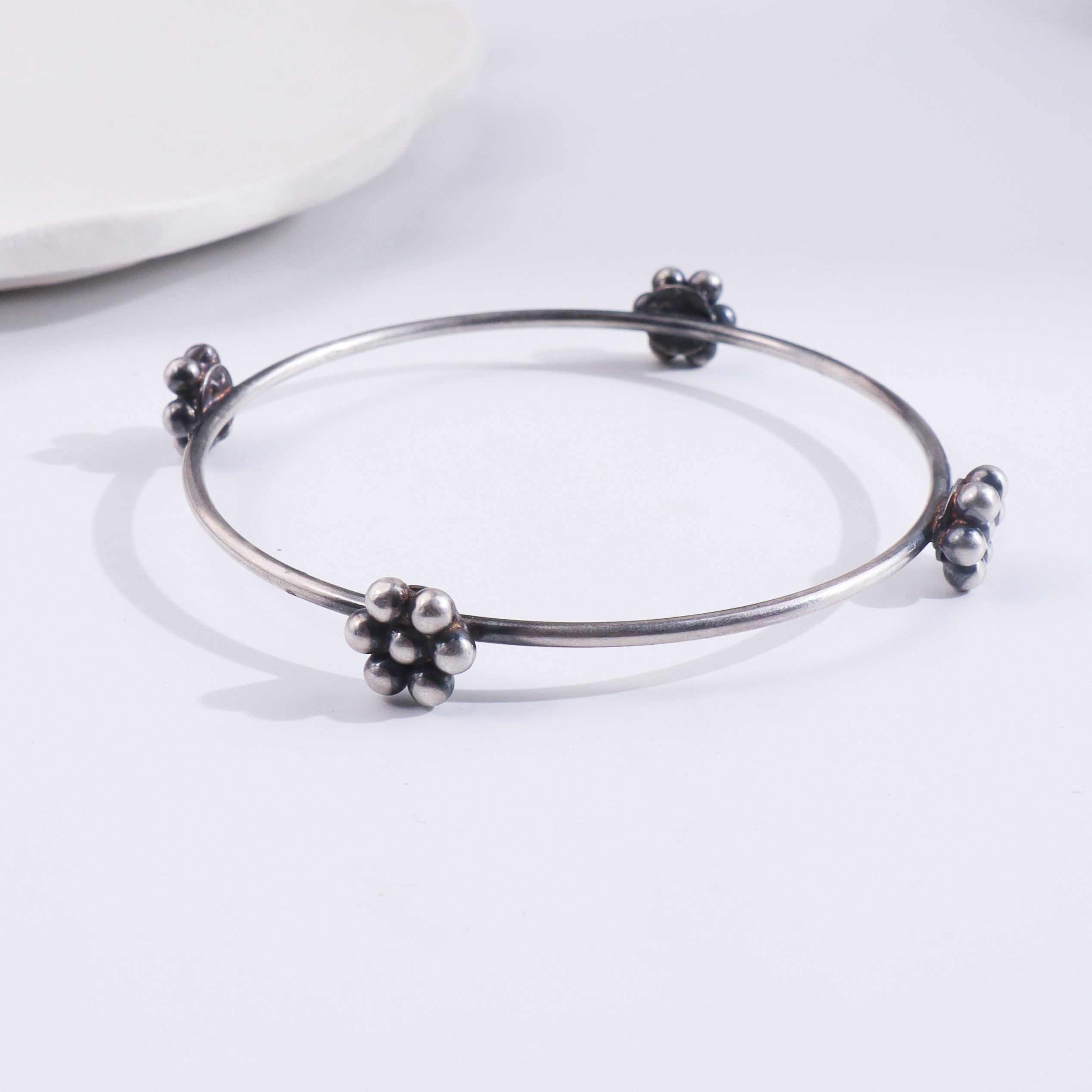 Silver Kudi Bangle with traditional design and intricate detailing
