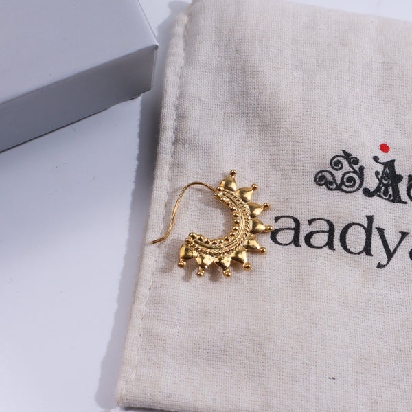 Gold Ghumat Nath jewelry on fabric with box