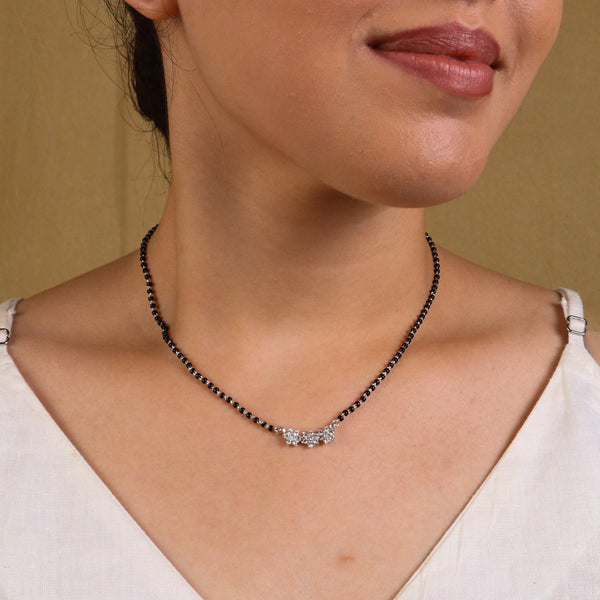 Silver beaded necklace with floral pendant