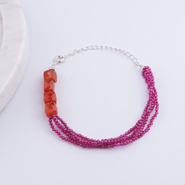 Detailed view of Carnelian & Ruby Silver Bracelet highlighting handcrafted silverwork, carnelian stones, ruby accents, and polished finish