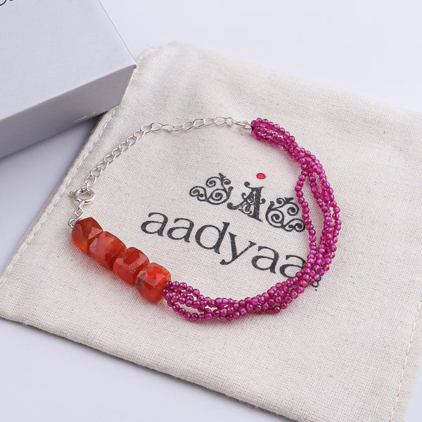 Model styling Carnelian & Ruby Silver Bracelet with an ethnic outfit for a refined traditional jewellery look