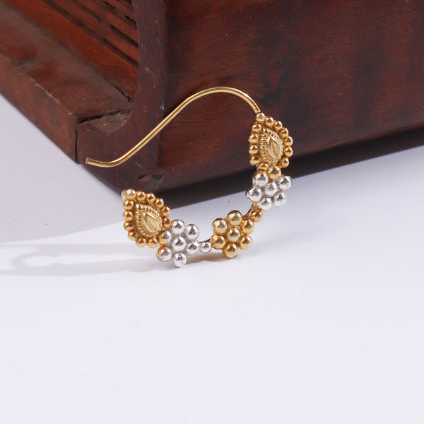 Gold and silver nose pin with traditional design for Indian jewelry