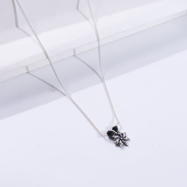 Silver chain with floral pendant
