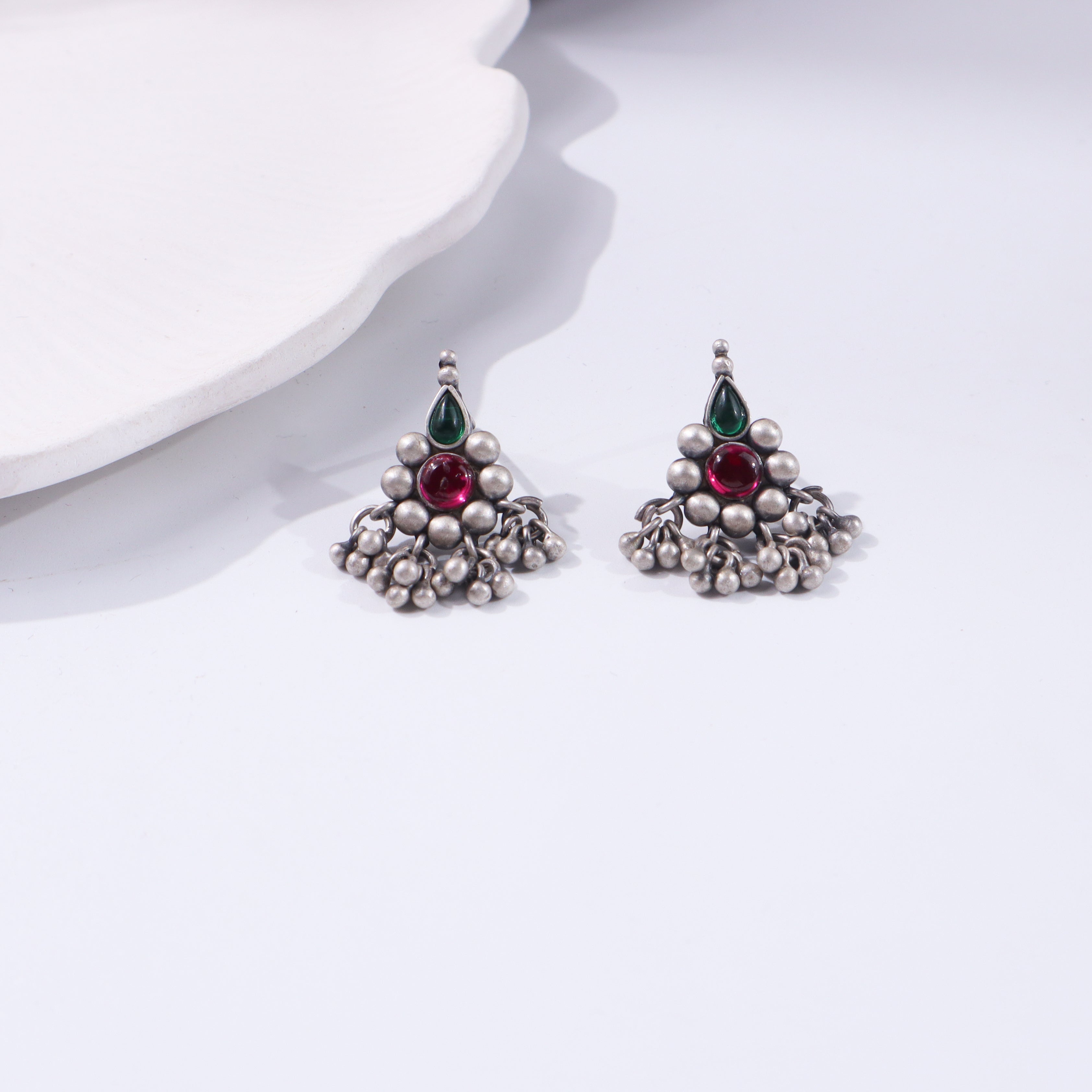 Silver earrings with green and red stones