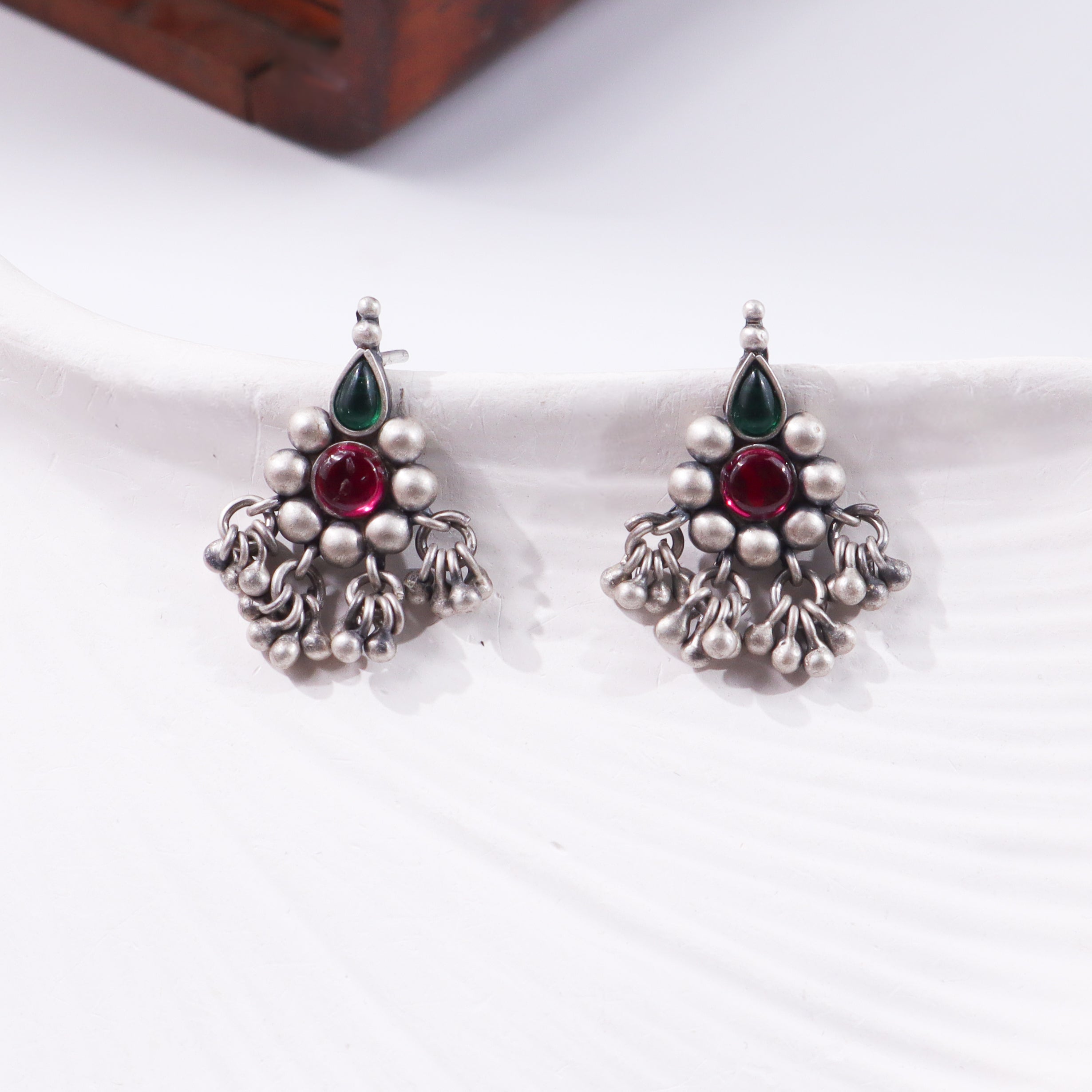 Silver earrings with green and red stones