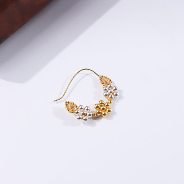 Gold and silver beaded earring with traditional design