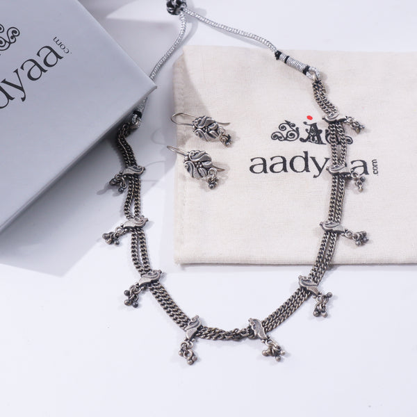Silver jewelry set with peacock motifs