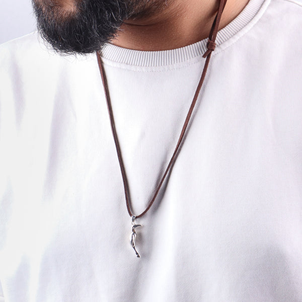 Man wearing Silver Hornbill pendant with Suede cord necklace