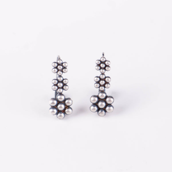 Angled side view of Kudi Dangling Earring in sterling silver