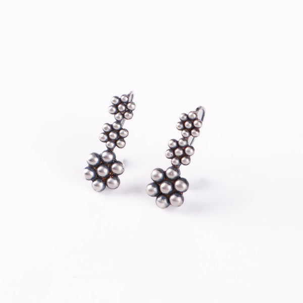 Detail shot of Kudi motif and polished silver finish
