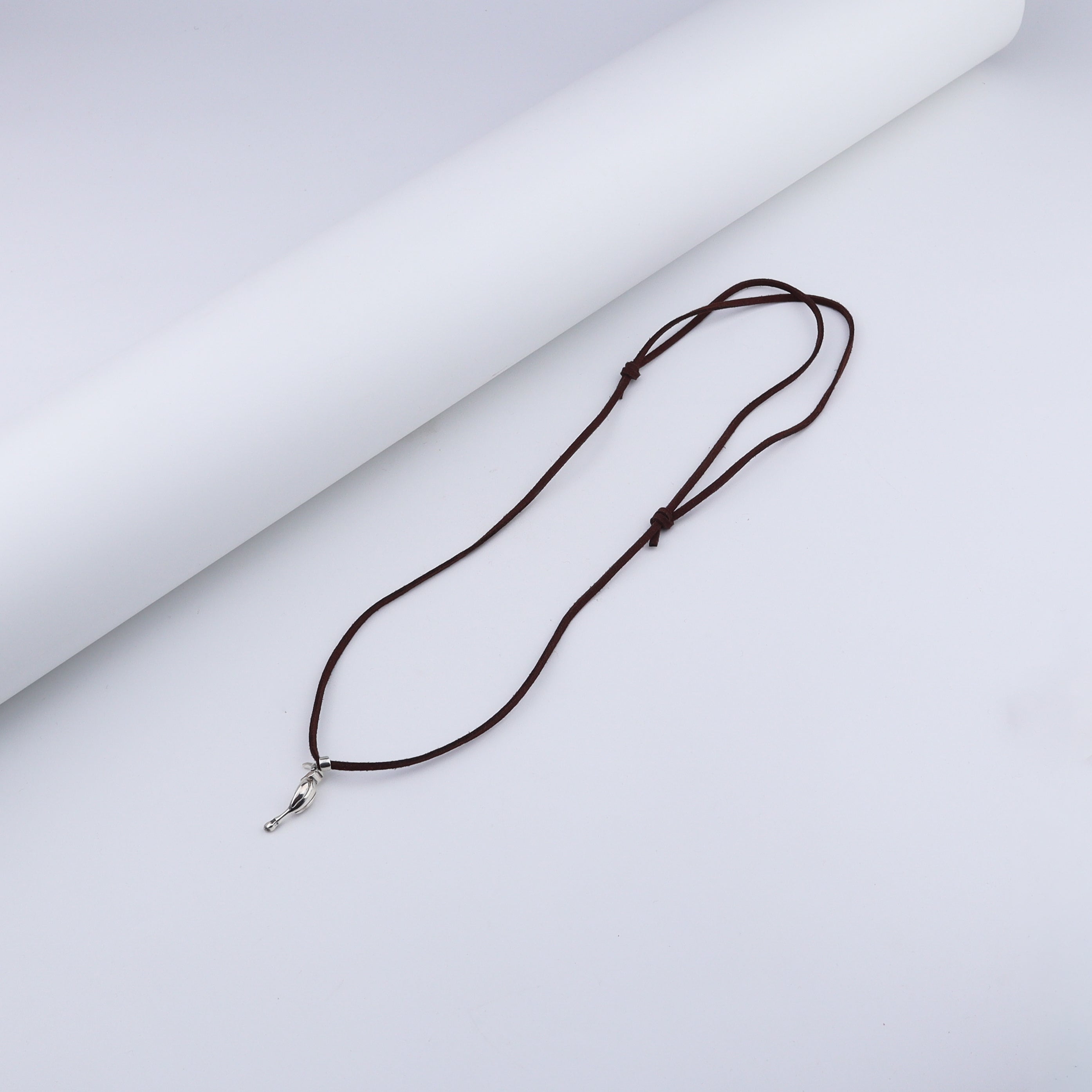 Unisex Silver Hornbill necklace with suede cord