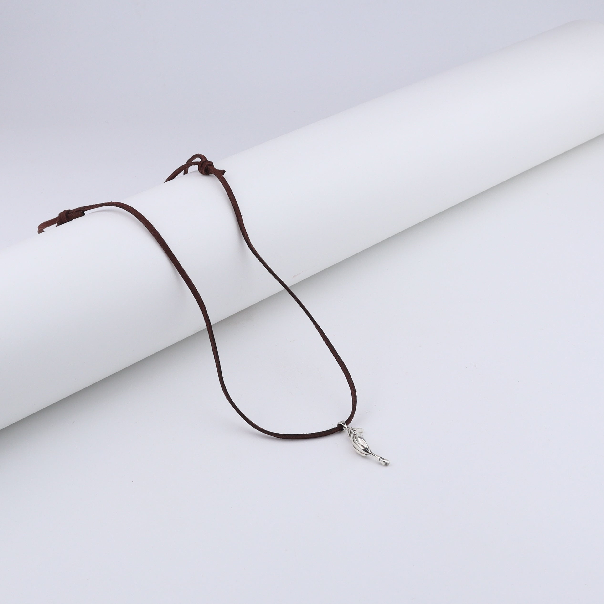 Unisex silver hornbill pendant with suede cord