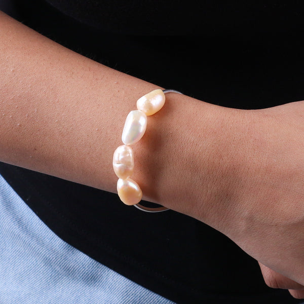 Close-up of freshwater pearl bracelet on wrist