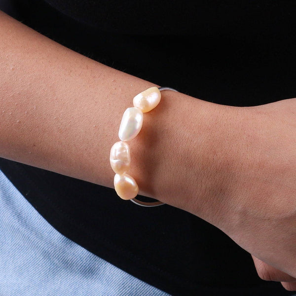 Close-up of freshwater pearl bracelet on wrist