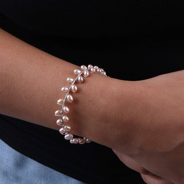 Close-up of pearl bracelet on wrist, silver jewelry, elegant accessory