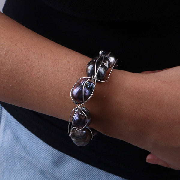 Close-up of black baroque pearls on silver wire bracelet, House of Aadyaa jewelry