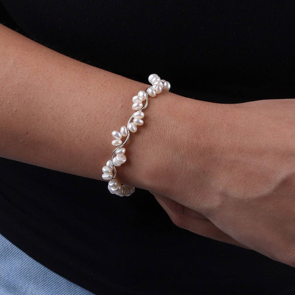 Close-up of pearl twisted bracelet on wrist