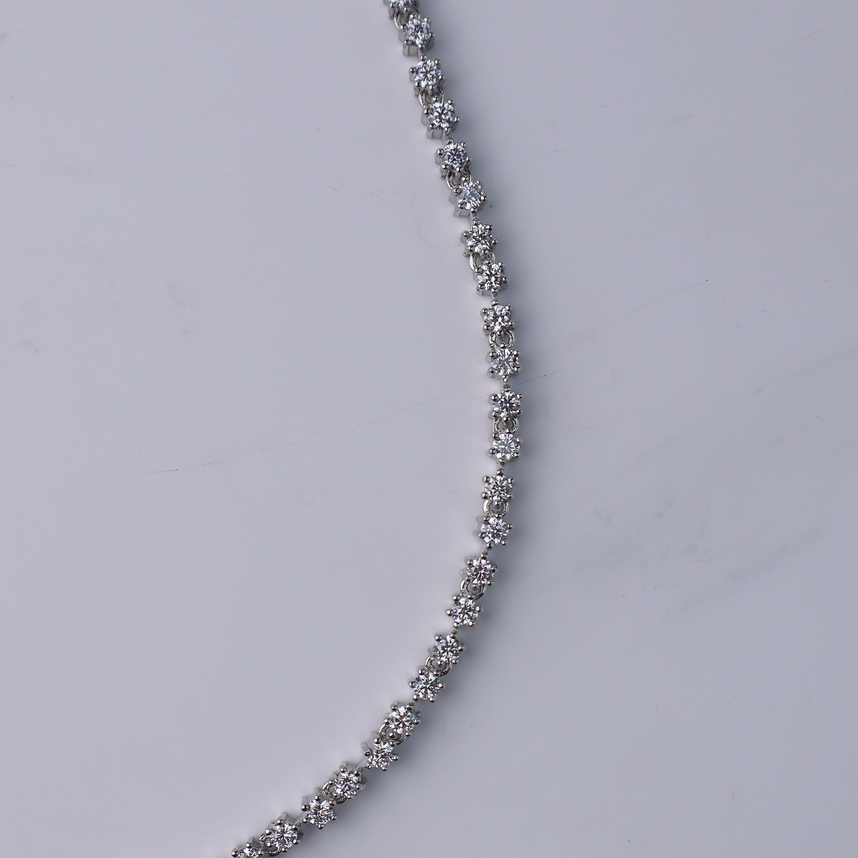 Close-up of cubic zirconia stones on silver jewelry set