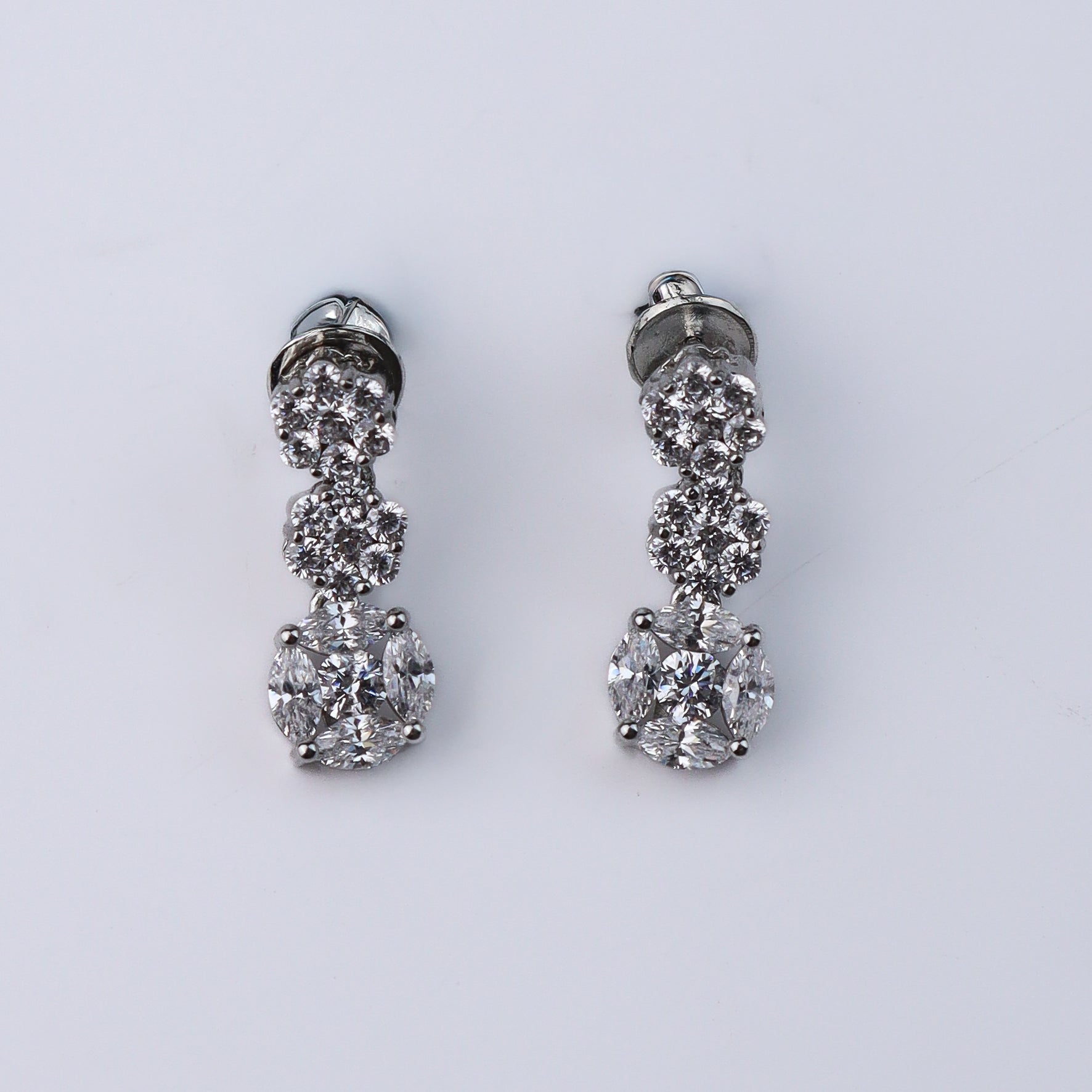 Back view of silver jewelry set with clasp and chain details