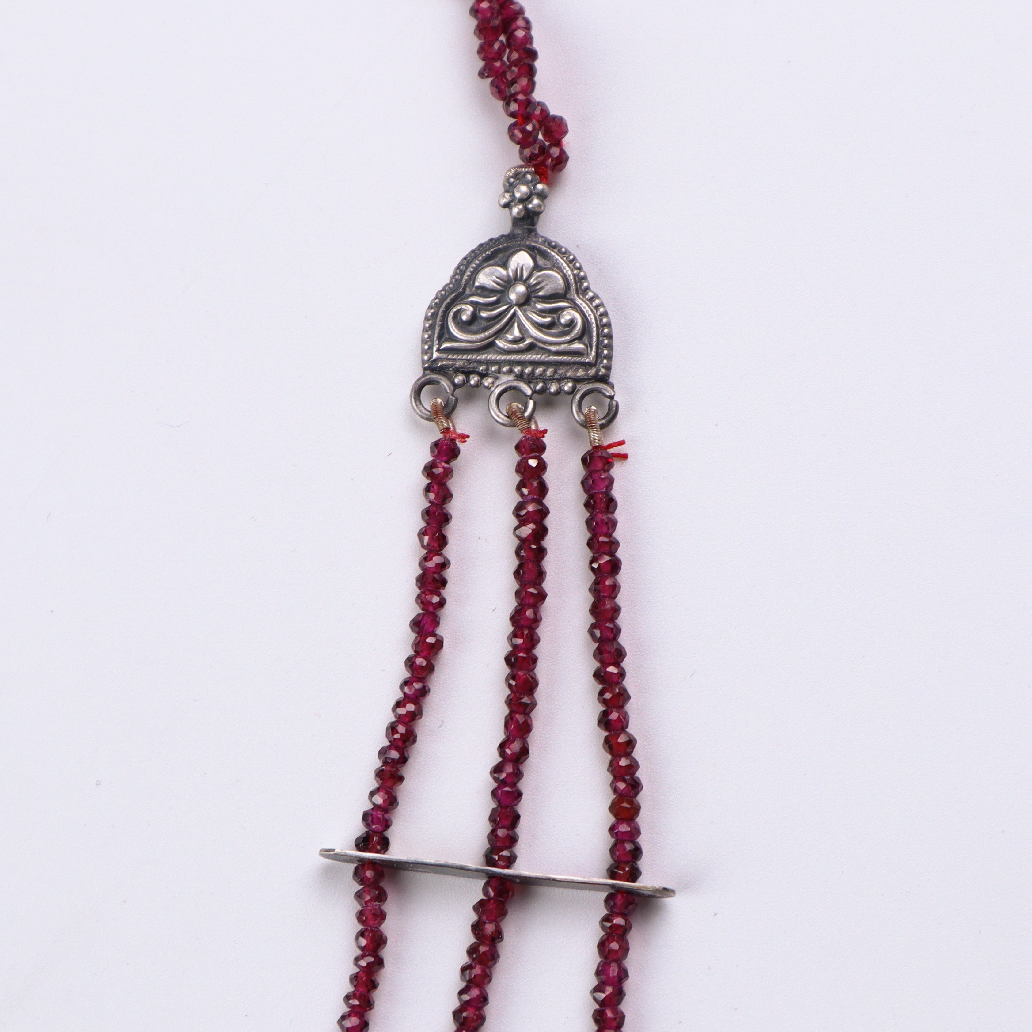 Flat-lay saaj motif garnet moonstone satlada necklace