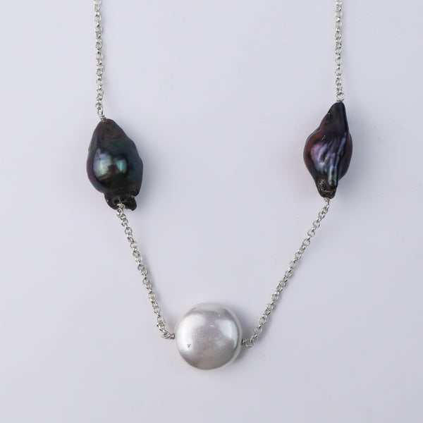 Close-up of silver chain with baroque pearls