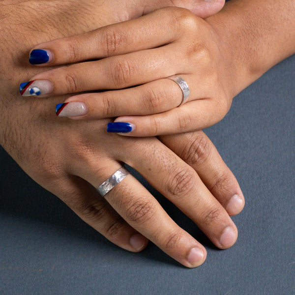 Hammered couple rings in silver with textured finish