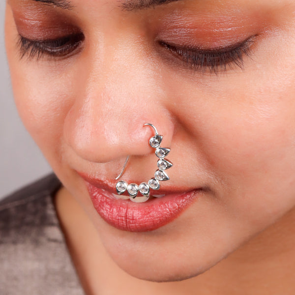 Model wearing CZ petal nath big pierced silver earring