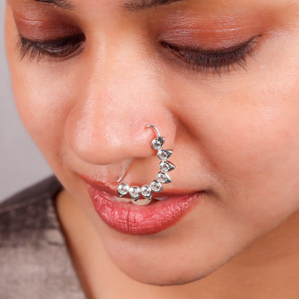 Model wearing CZ petal nath big pierced silver earring