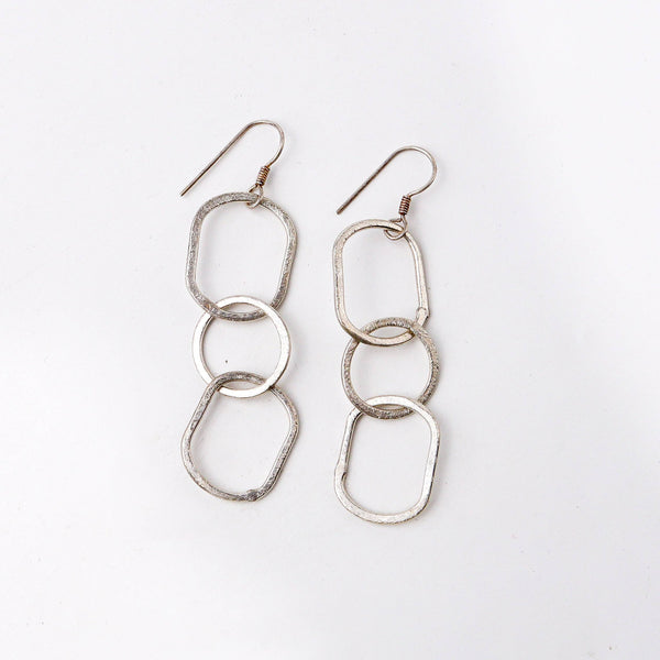 Detailed view of the fashion earring highlighting intricate motifs, textured detailing, and smooth jewelry finish