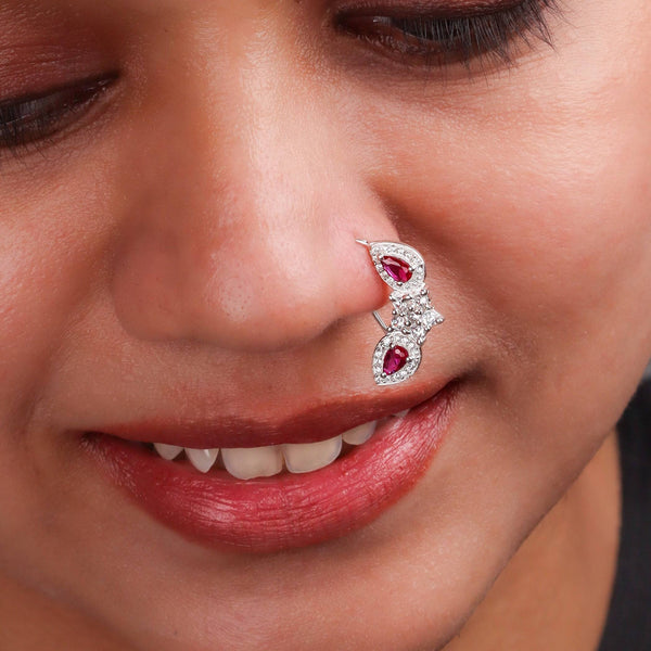 Model wearing silver flower pink drop nath with cz stones pierced small