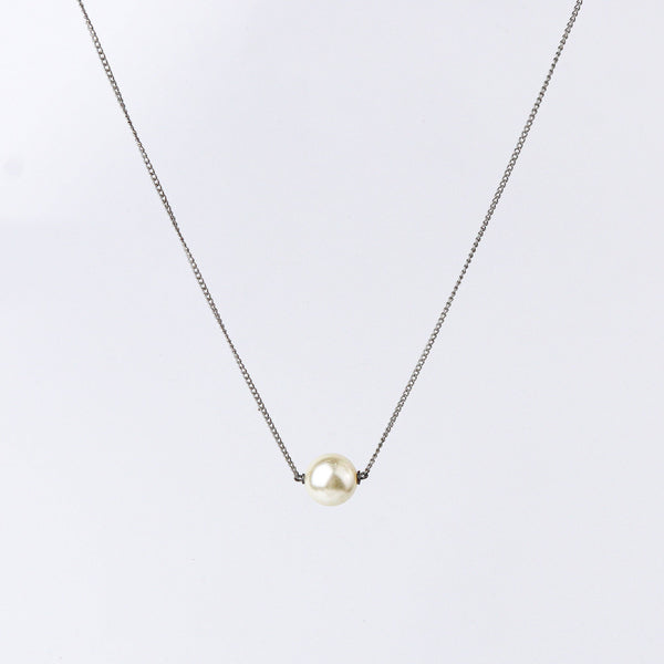 Close-up of the Pearl Chain Fashion Necklace showcasing delicate chain links, smooth pearl accents, and fine craftsmanship