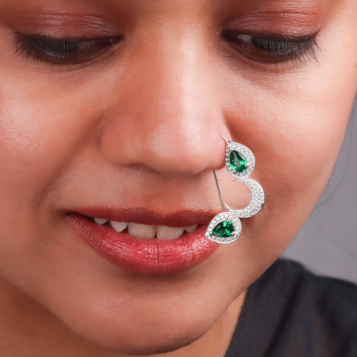 Model wearing silver green drop Nath earrings