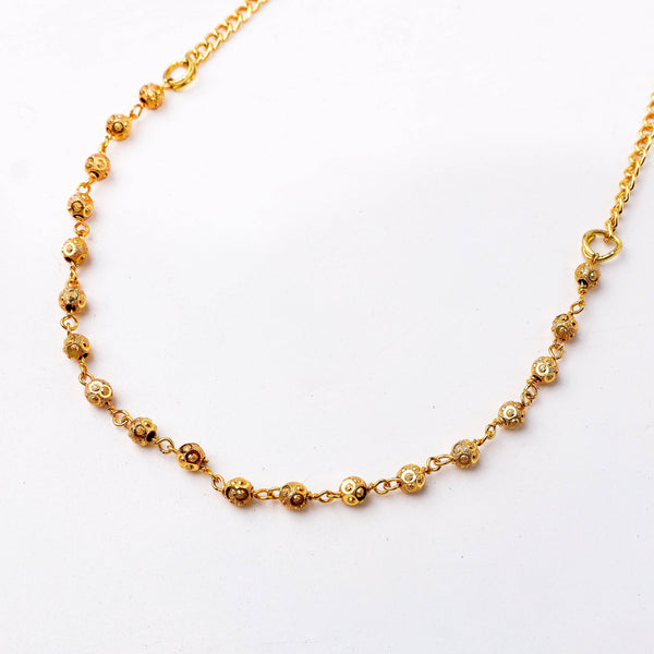 Close-up of a 22K gold-plated fashion chain showcasing intricate chain links, fine craftsmanship, and rich 22K gold plating