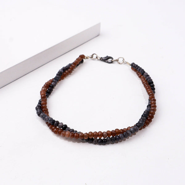 Angled view of a fashion bracelet highlighting its unique structure, stylish silhouette, and polished finish