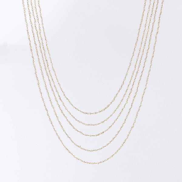 Close-up of a 22K gold-plated fashion necklace showcasing intricate detailing, fine craftsmanship, and rich 22K gold plating