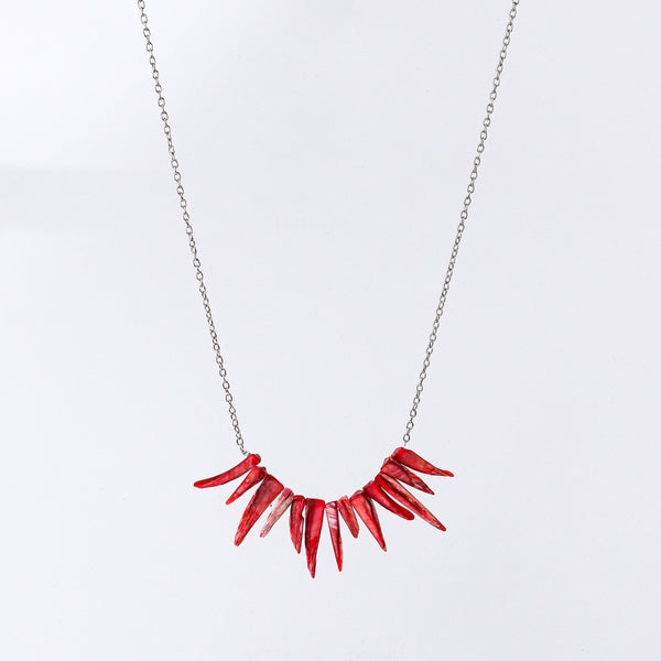 Close-up of fashion necklace showcasing intricate detailing, fine craftsmanship, and refined finish