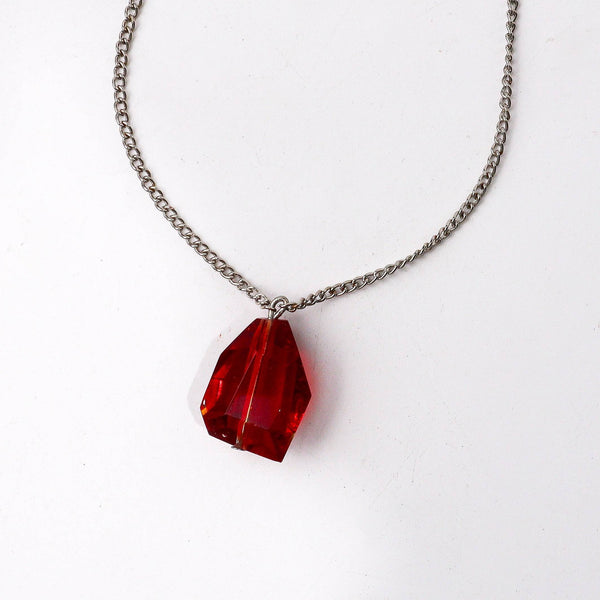 Close-up of a fashion chain necklace showcasing intricate chain links, fine craftsmanship, and refined detailing