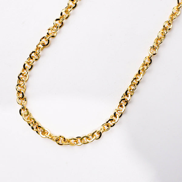 Close-up of a 22K gold-plated fashion chain showcasing intricate chain links, fine craftsmanship, and rich 22K gold plating