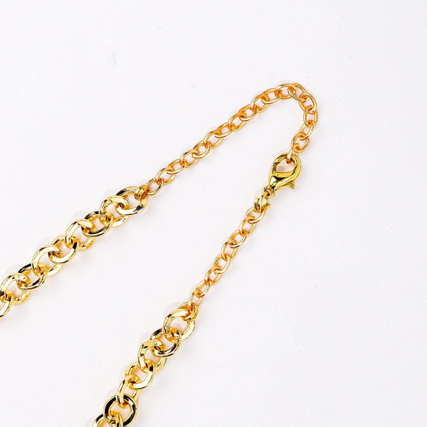 Angled view of a 22K gold-plated fashion chain highlighting its unique structure, elegant links, and polished gold finish